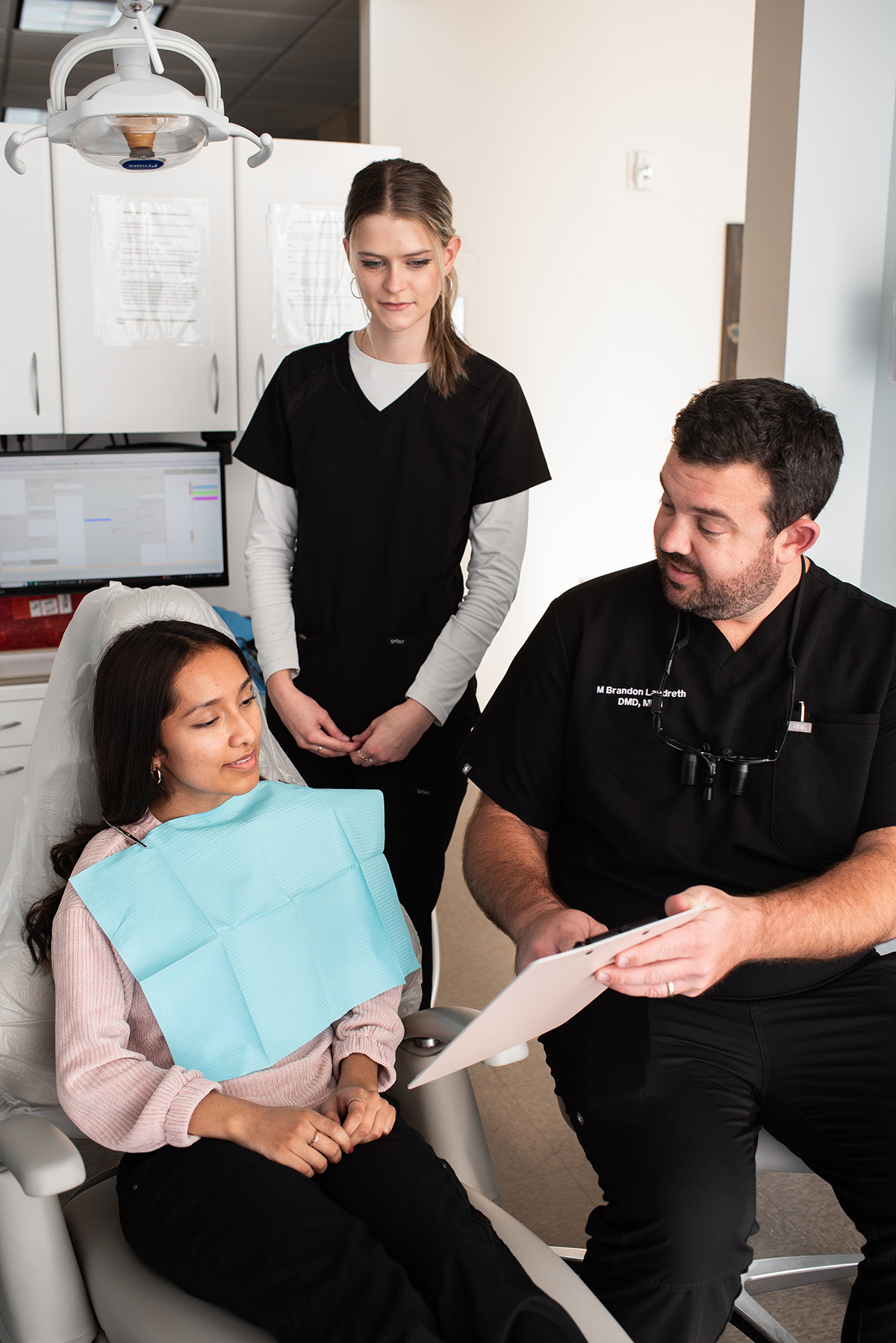 Carolina Roots Dental dentist discussing treatment with a patient