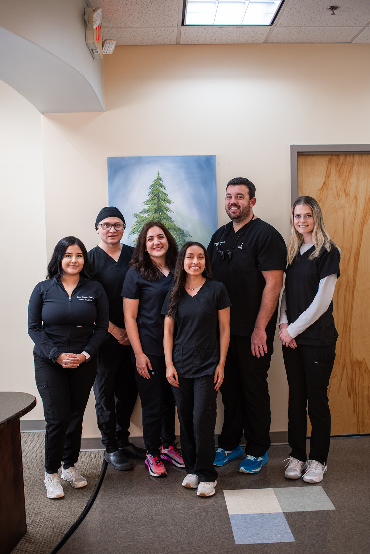 Carolina Roots Dental team standing together in the practice